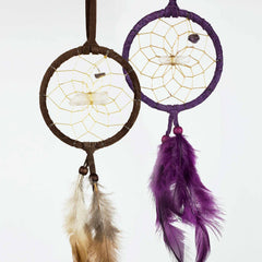 Two finished healing dream catchers with tan and purple rings, beads and feather tassels