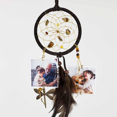 Finished nurture dream catcher with dark hoops, beads, feather tassels and small keepsake photos