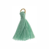 Pompons en polycoton turquoise de 1 po avec anneau de saut 10/pqt