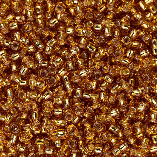 Perles de rocaille Toho 15/0 #22C Topaze doublée d'argent Flacon de 8 à 9 g