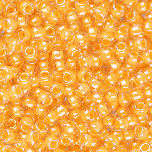 Perles de rocaille Toho 11/0 #984 Flacon de cristal doublé de papaye 8-9g