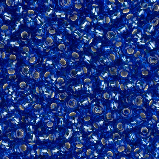 Perles de rocaille tchèques 11/0 #34979 bleu foncé doublé d'argent 23g
